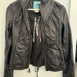 Black leather jacket by Marciano. size XS. Almost new.